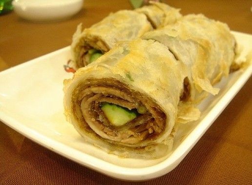 招牌菜名叫\大饼卷牛肉\