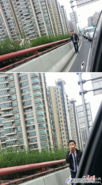 手拿口琴吹奏的男子在早高峰时段的上海高架上悠闲行走(网友供图) 手拿口琴吹奏的男子在早高峰时段的上海高架上悠闲行走(网友供图)
