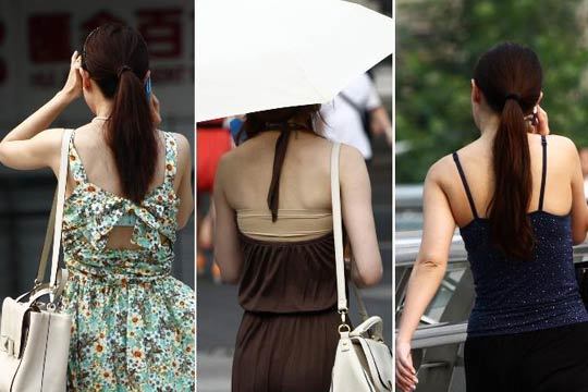 街头年轻女子清凉露背装